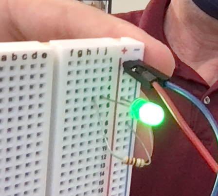 A circuit on a breadboard with power rails